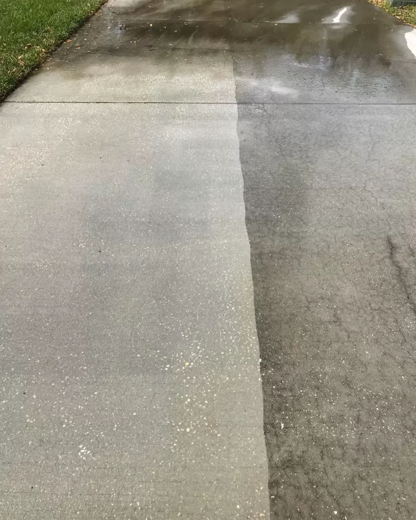 Before and after pressure washing of a concrete sidewalk showing a clean half and a dirty half